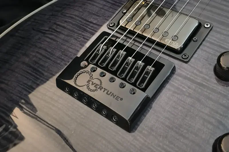 Electric guitar bridge during adjustment at the Septyma Guitars workshop, Kraków